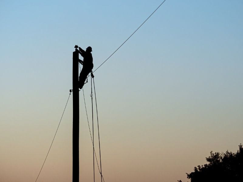 lineperson fixing a power line